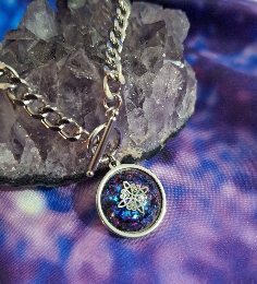 COLGANTE NUDO DE BRUJAS-1 DE ACERO Y TURMALINA.