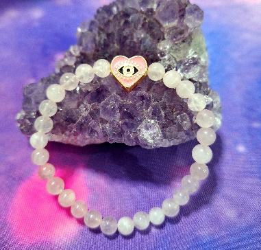 PULSERA DE CUARZO ROSA CON OJO TURCO DE ACERO INOXIDALE