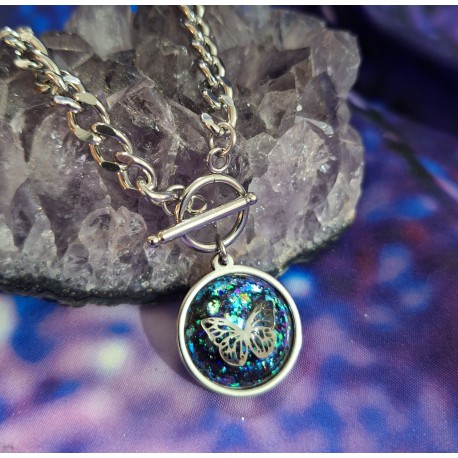 COLGANTE CON MARIPOSA DE ACERO Y TURMALINA.